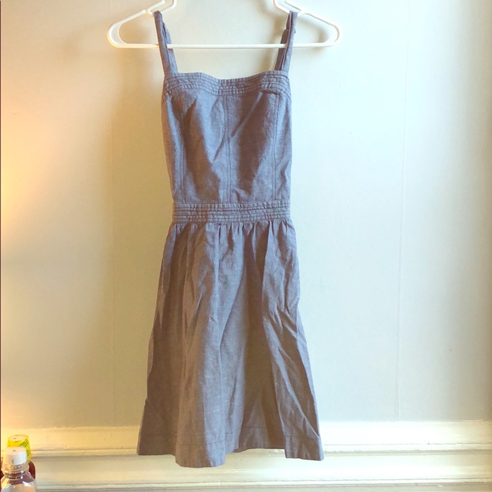 A cross back dress with zipper up